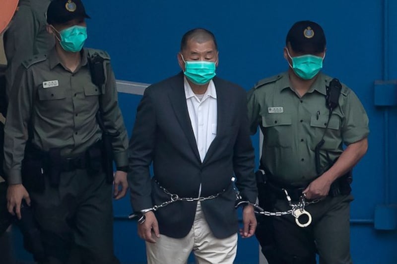 2020年12月,香港媒体大亨黎智英被捕入监服刑。(路透社图片)