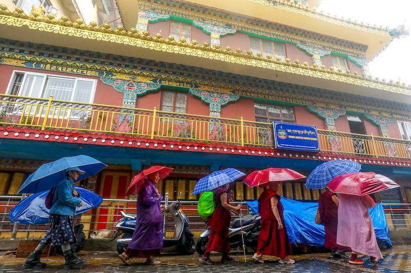 Tibetan nuns and monks walk in Dharamsala  July 1, 2025.